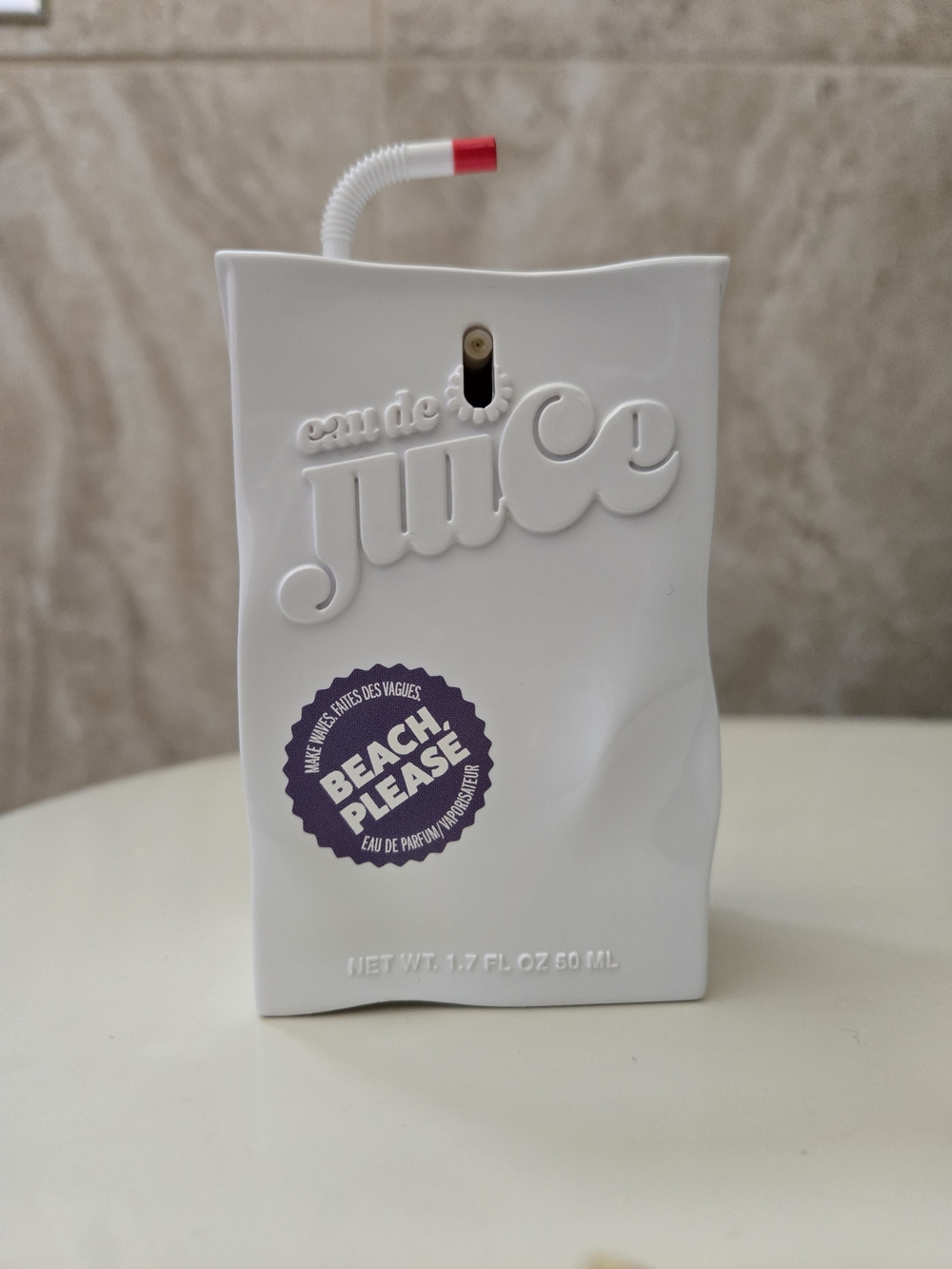 Juicy Couture White Bottle with Purple 'Beach Please' Label